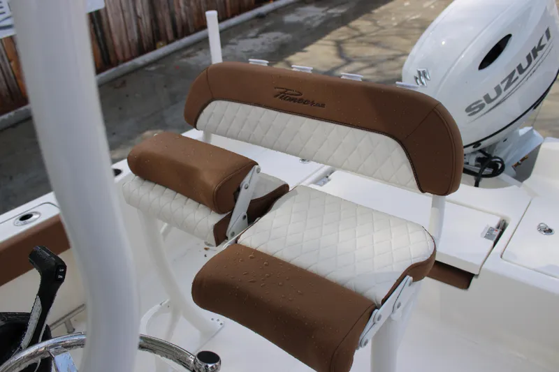 Slide: The Image of 2025 Pioneer 220 Bay Sport boat seats with Suzuki engine in background. - 15