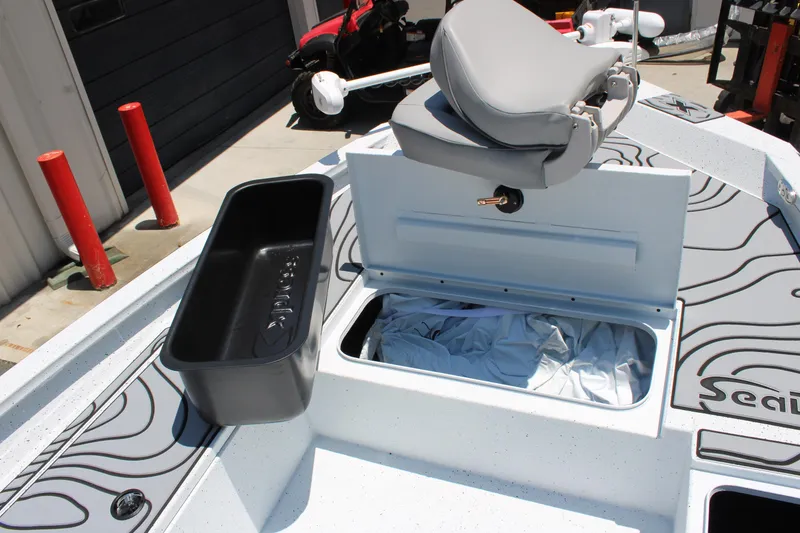 Slide: The Image of 2026 Xpress H22B Bay boat interior with storage compartments and seating. - 6