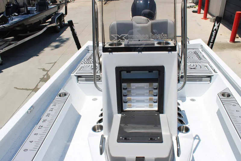 Slide: The Image of 2026 Xpress H22B Bay boat interior with storage compartments and measuring guides. - 8