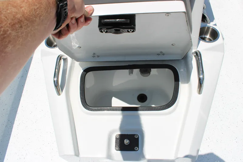 Slide: The Image of Open storage compartment on 2026 Xpress H22B Bay boat. - 9