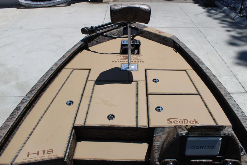 Slide: The Image of 2026 Xpress H18 boat deck with SeaDek flooring and Garmin equipment. - 6