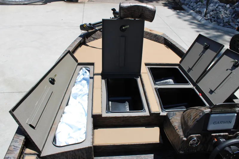 Slide: The Image of 2026 Xpress H18 boat interior with open storage compartments and Garmin equipment. - 8