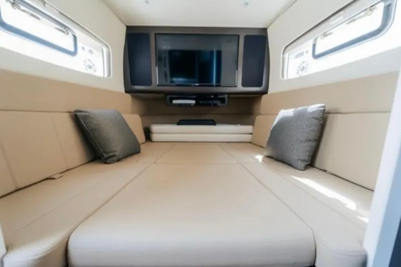 Slide: The Image of Luxurious interior cabin of 2021 Scout 380 LXF with TV and plush seating. - 22