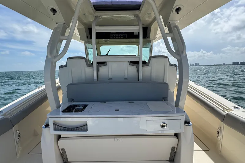 Slide: The Image of 2021 Scout 380 LXF boat interior with seating and ocean view. - 29