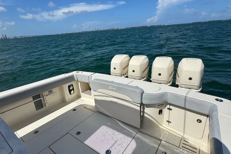 Slide: The Image of 2021 Scout 380 LXF boat with four engines on open water. - 30