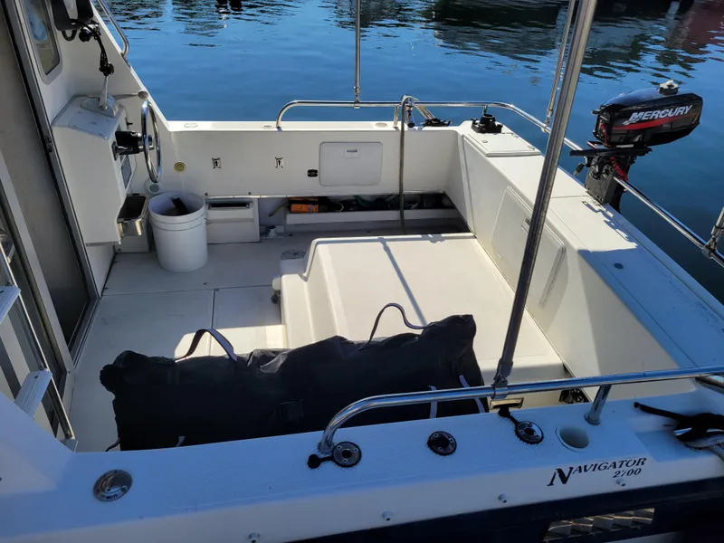 Slide: The Image of 2001 SeaSport 2700 Navigator boat interior with Mercury outboard motor. - 10