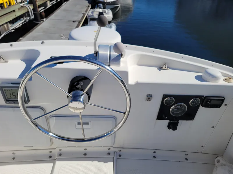 Slide: The Image of Steering wheel and dashboard of a 2001 SeaSport 2700 Navigator boat. - 15