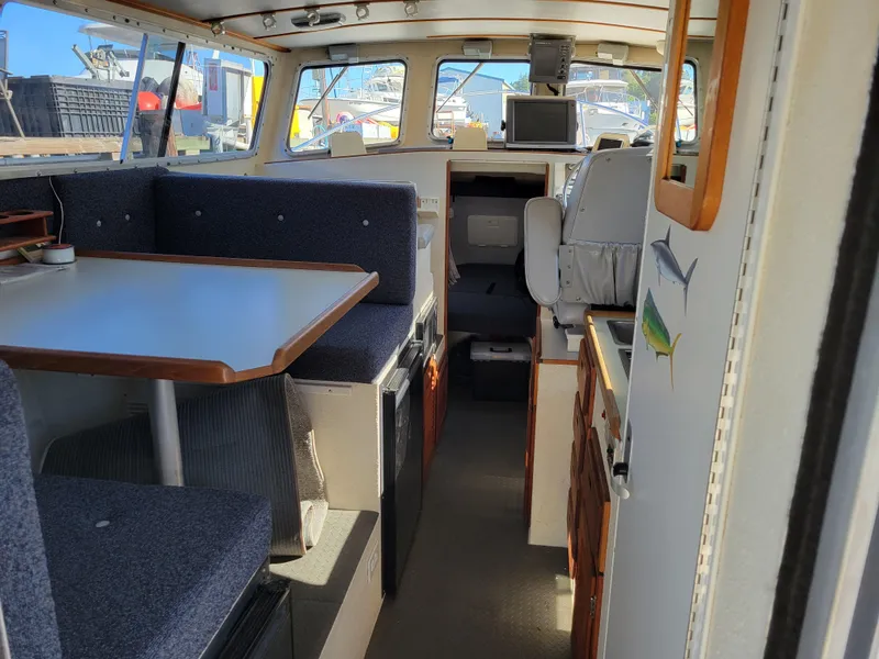 Slide: The Image of Interior of 2001 SeaSport 2700 Navigator boat with seating and navigation equipment. - 16