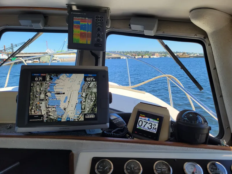 Slide: The Image of Interior view of 2001 SeaSport 2700 Navigator boat with navigation equipment and waterway map. - 26