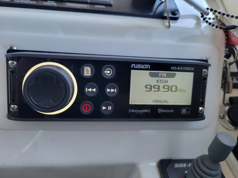 Slide: The Image of Fusion MS-RA70NSX radio on 2001 SeaSport 2700 Navigator, tuned to 99.90 MHz FM. - 33