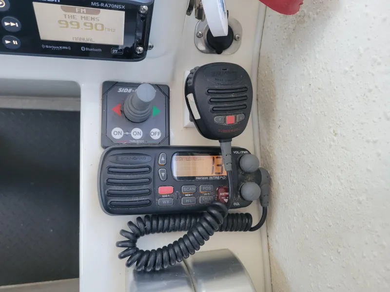 Slide: The Image of Control panel of a 2001 SeaSport 2700 Navigator with radio and communication equipment. - 34