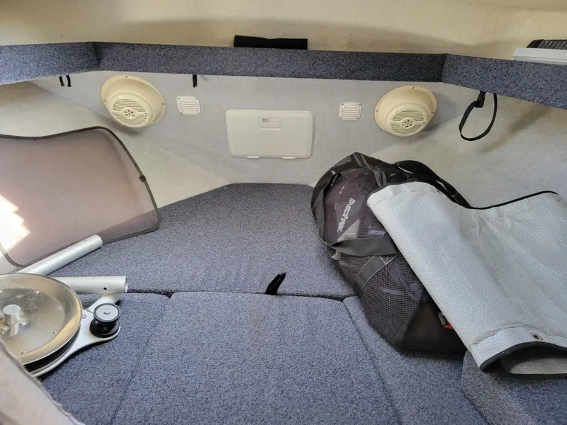 Slide: The Image of 2001 SeaSport 2700 Navigator cabin interior with speakers and storage items. - 39