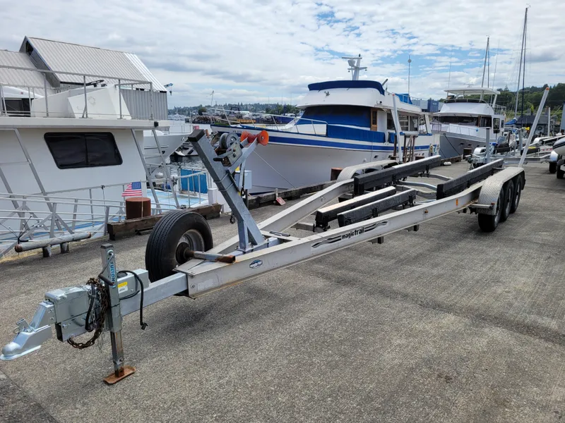 Slide: The Image of Boat trailer at marina, SeaSport 2700 Navigator, 2001 model, with yachts in background. - 42