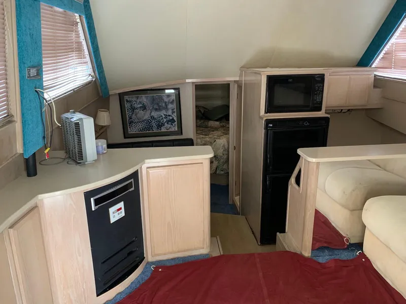 Slide: The Image of Interior of a 1997 Henriques 38 Sportfisherman with kitchen and seating area. - 2