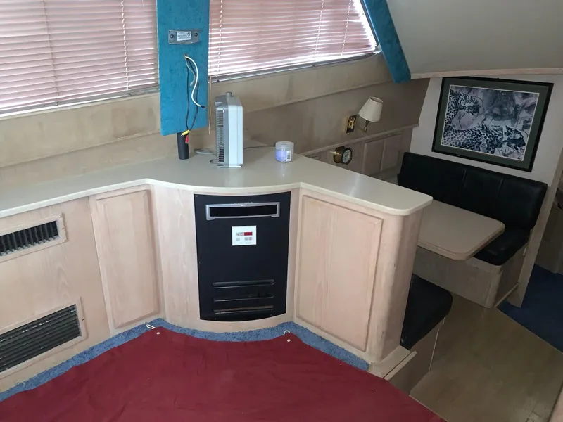 Slide: The Image of Interior of 1997 Henriques 38 Sportfisherman with seating area and cabinetry. - 3