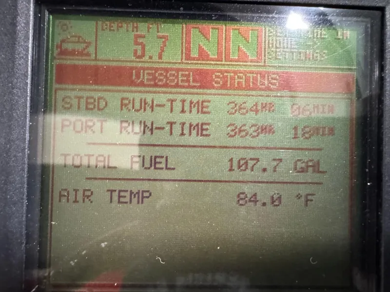Slide: The Image of Display screen showing vessel status, fuel level, and air temperature on a 2005 Sea Ray 290 SLX. - 14