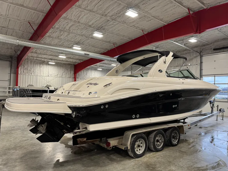 Slide: The Image of 2005 Sea Ray 290 SLX boat on trailer in indoor storage facility. - 3