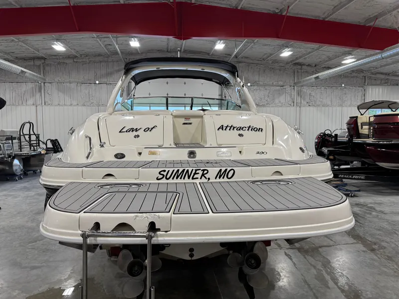 Slide: The Image of 2005 Sea Ray 290 SLX boat in a garage, featuring "Law of Attraction" text. - 5