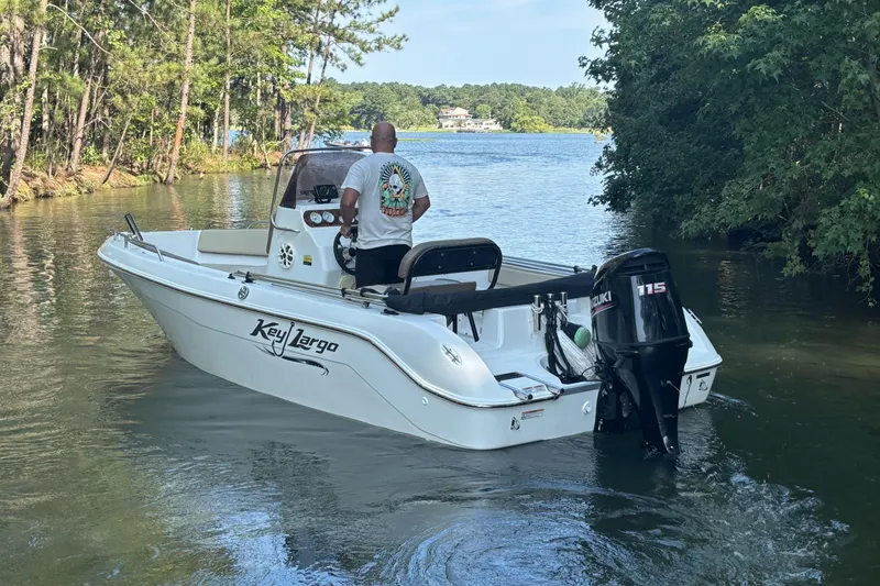 Slide: The Image of A 2019 Key Largo 2000 boat with Suzuki 115 engine on a scenic lake. - 10