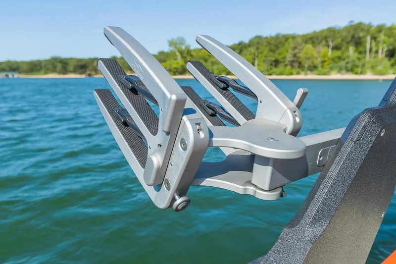 Slide: The Image of Wakeboard rack on 2018 Malibu Wakesetter 24 MXZ, lake background. - 10