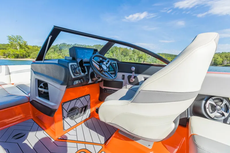 Slide: The Image of 2018 Malibu Wakesetter 24 MXZ boat interior with modern dashboard and steering wheel. - 12