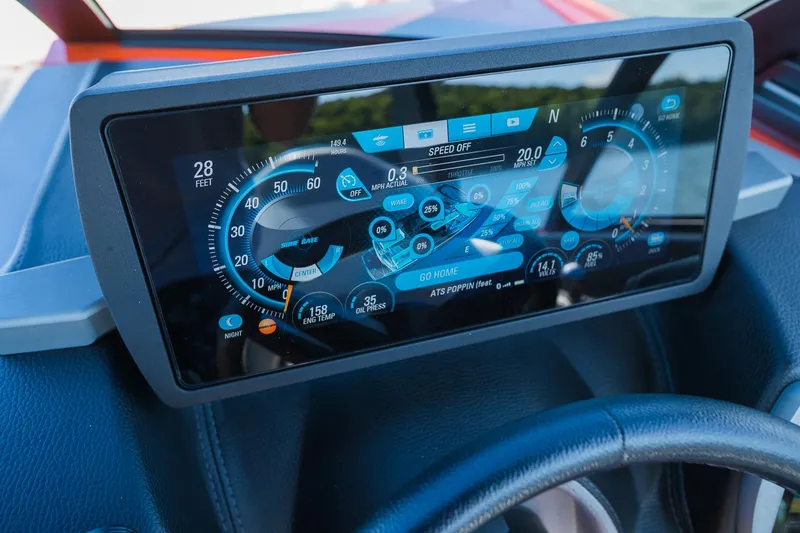 Slide: The Image of Dashboard display of 2018 Malibu Wakesetter 24 MXZ boat with digital gauges and controls. - 13