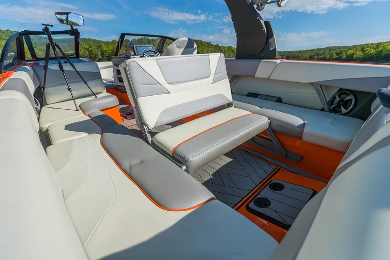 Slide: The Image of 2018 Malibu Wakesetter 24 MXZ interior with modern seating and sleek design. - 8