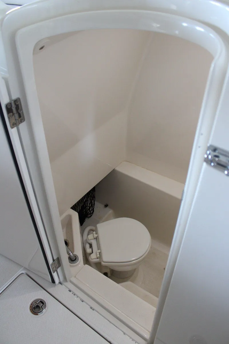 Slide: The Image of 2018 Jupiter 30 HFS boat interior with compact marine toilet. - 12