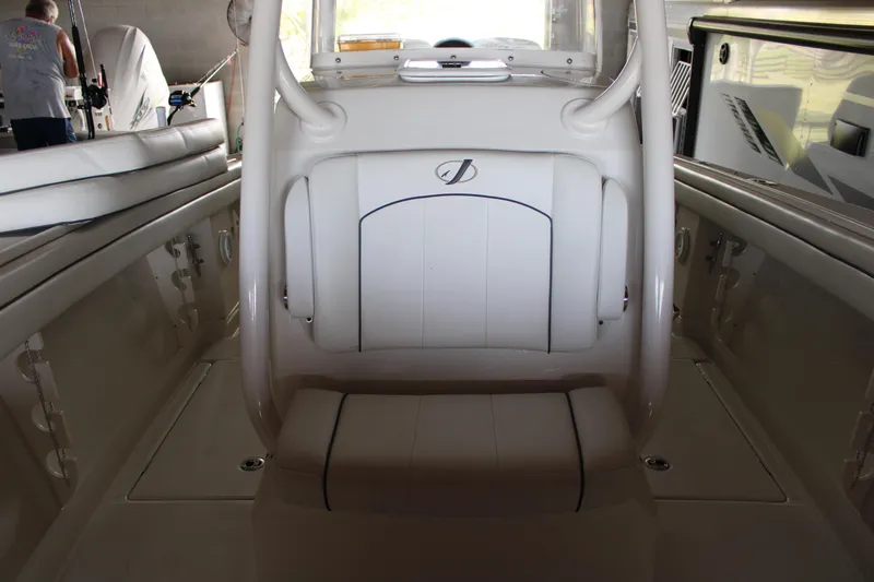 Slide: The Image of Interior of a 2018 Jupiter 30 HFS boat, featuring white seating and sleek design. - 13