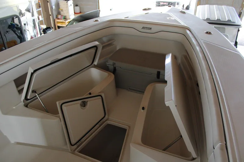 Slide: The Image of 2018 Jupiter 30 HFS boat interior with open storage compartments. - 15