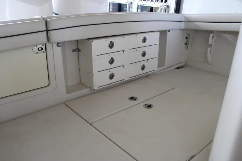 Slide: The Image of 2018 Jupiter 30 HFS boat interior with storage compartments and seating area. - 18