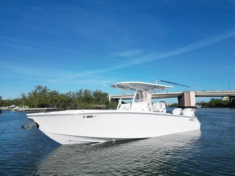 Slide: The Image of 2018 Jupiter 30 HFS boat on calm water under clear blue sky. - 2
