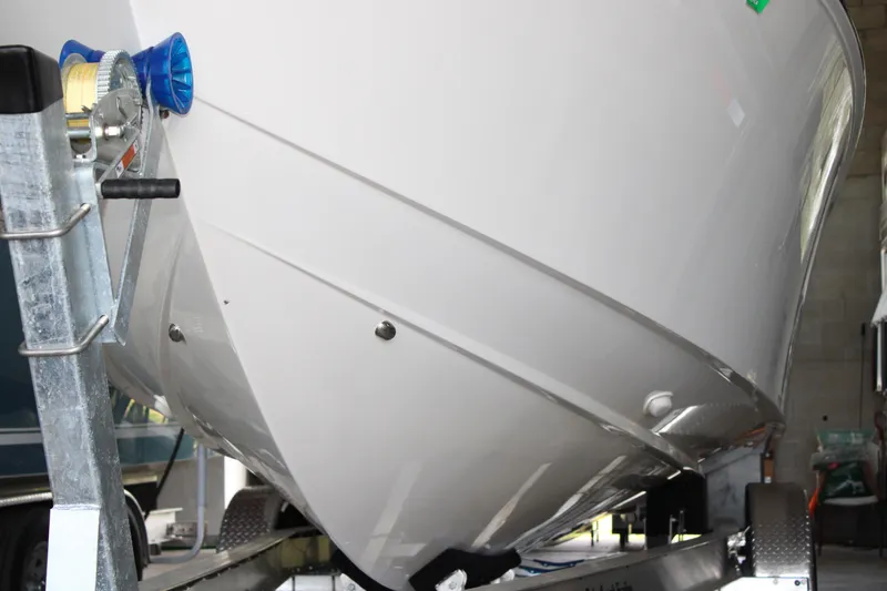 Slide: The Image of 2018 Jupiter 30 HFS boat on trailer, close-up of hull and winch. - 25