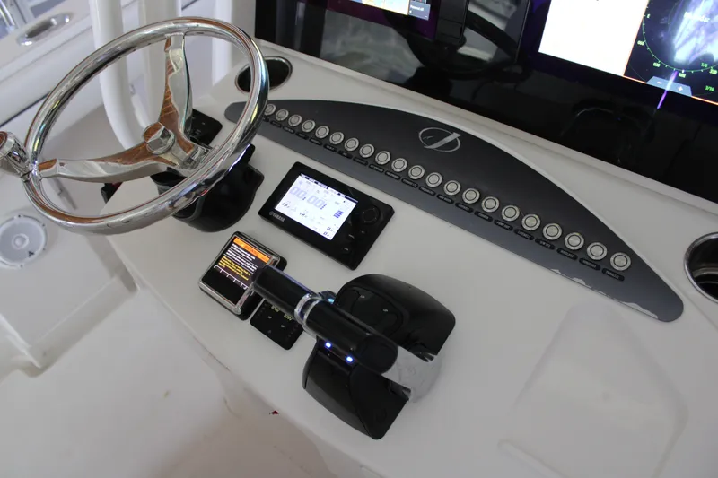 Slide: The Image of Control panel of 2018 Jupiter 30 HFS boat with steering wheel and electronic displays. - 6