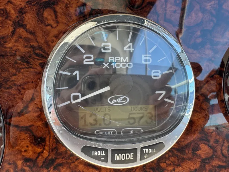 Slide: The Image of Close-up of a 2005 Sea Ray 300 Sundancer tachometer displaying RPM, volts, and engine hours. - 9