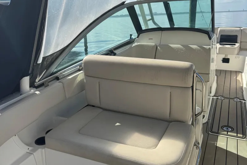 Slide: The Image of 2015 Boston Whaler 270 Vantage interior with beige seating and sleek design. - 8