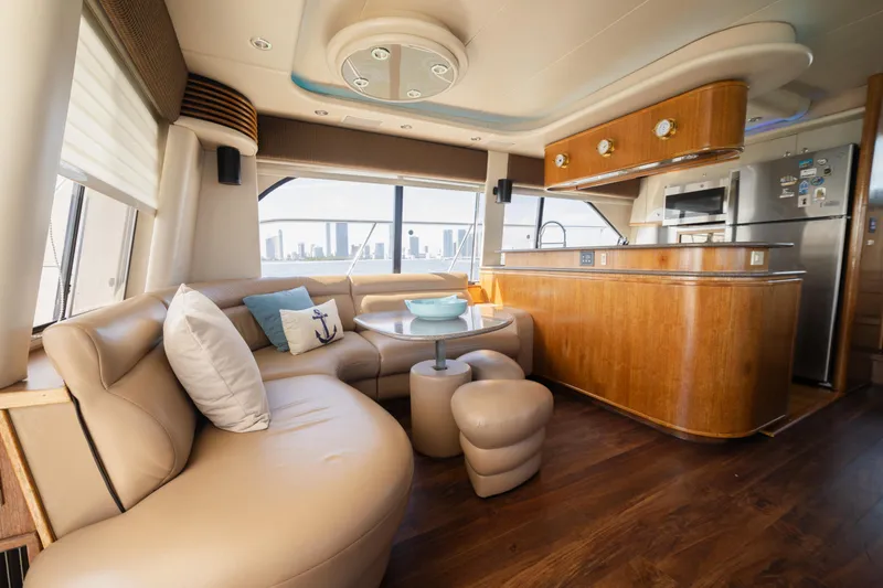 Slide: The Image of Luxurious interior of a 1999 Bayliner 5788 yacht with elegant seating and modern kitchen. - 14