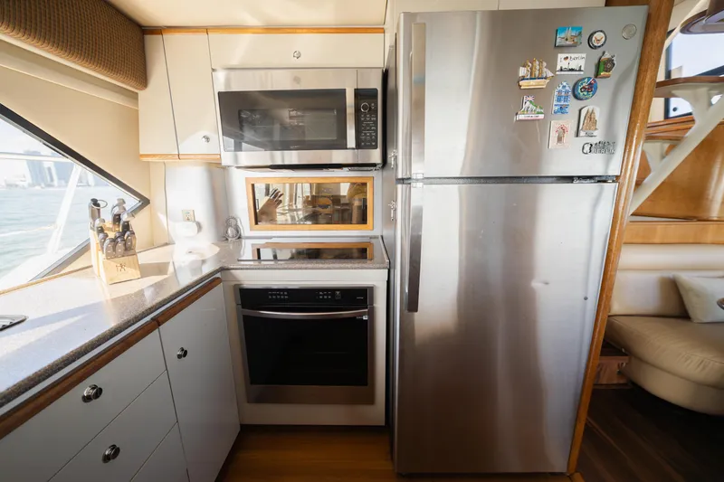 Slide: The Image of Modern kitchen in a 1999 Bayliner 5788 yacht with stainless steel appliances. - 20