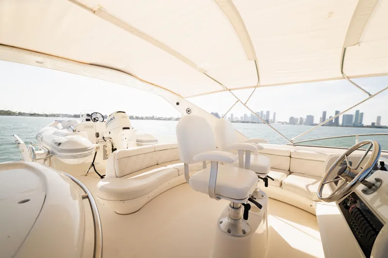 Slide: The Image of Luxurious 1999 Bayliner 5788 yacht interior with city skyline view. - 33