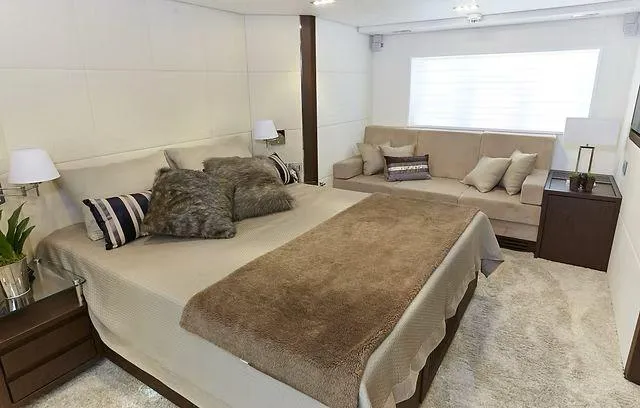 Slide: The Image of Luxurious bedroom in 2026 Schaefer 25M yacht with cozy bed and elegant decor. - 10