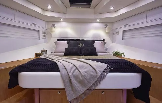 Slide: The Image of Luxurious cabin interior of 2026 Schaefer 25M yacht with elegant bedding and ambient lighting. - 14