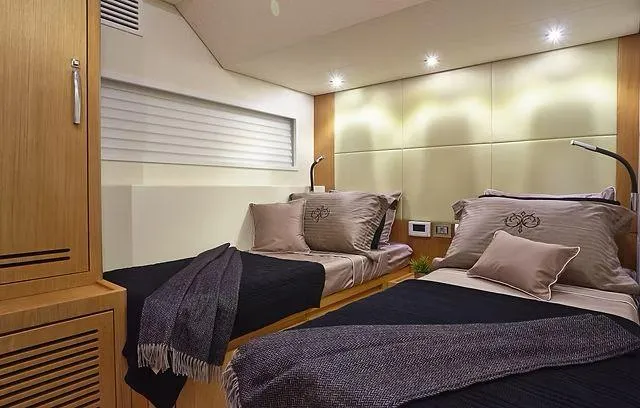 Slide: The Image of Luxurious cabin interior of 2026 Schaefer 25M yacht with twin beds and modern decor. - 18