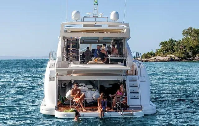 Slide: The Image of Luxury Schaefer 25M yacht, 2026 model, with people relaxing on deck in scenic ocean setting. - 4