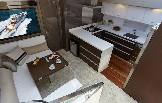Slide: The Image of Luxurious interior of 2026 Schaefer 25M yacht with modern kitchen and cozy seating area. - 8