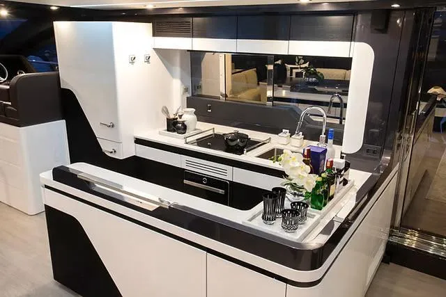 Slide: The Image of Modern kitchen interior on Schaefer 770 yacht, 2026 model, featuring sleek design and luxury amenities. - 11