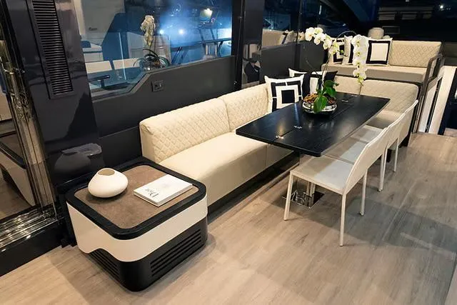 Slide: The Image of Luxurious interior of 2026 Schaefer 770 yacht with elegant seating and dining area. - 12
