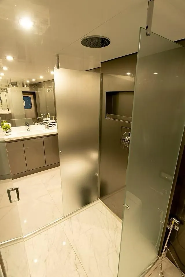 Slide: The Image of Luxurious Schaefer 770 yacht bathroom with modern fixtures and glass shower, 2026 model. - 19