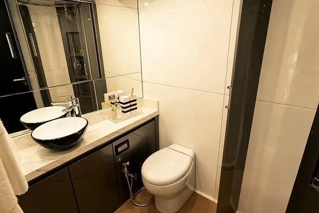 Slide: The Image of Modern yacht bathroom with sleek fixtures, vessel sink, and elegant design. Schaefer 770, 2026 model. - 21