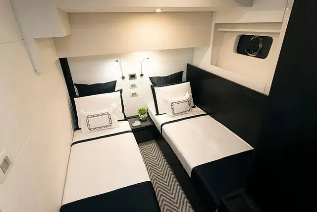 Slide: The Image of Luxurious twin cabin interior on Schaefer 770 yacht, 2026 model, with modern decor and lighting. - 22