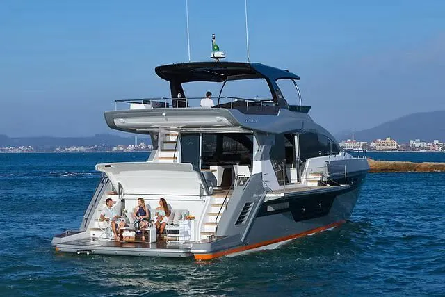 Slide: The Image of Luxury Schaefer 770 yacht cruising on the ocean, 2026 model, with people relaxing on deck. - 24